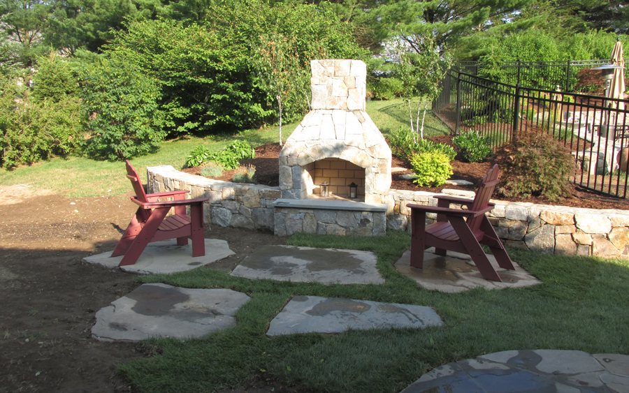 Residential hardscape project with decorative concrete and masonry surfaces